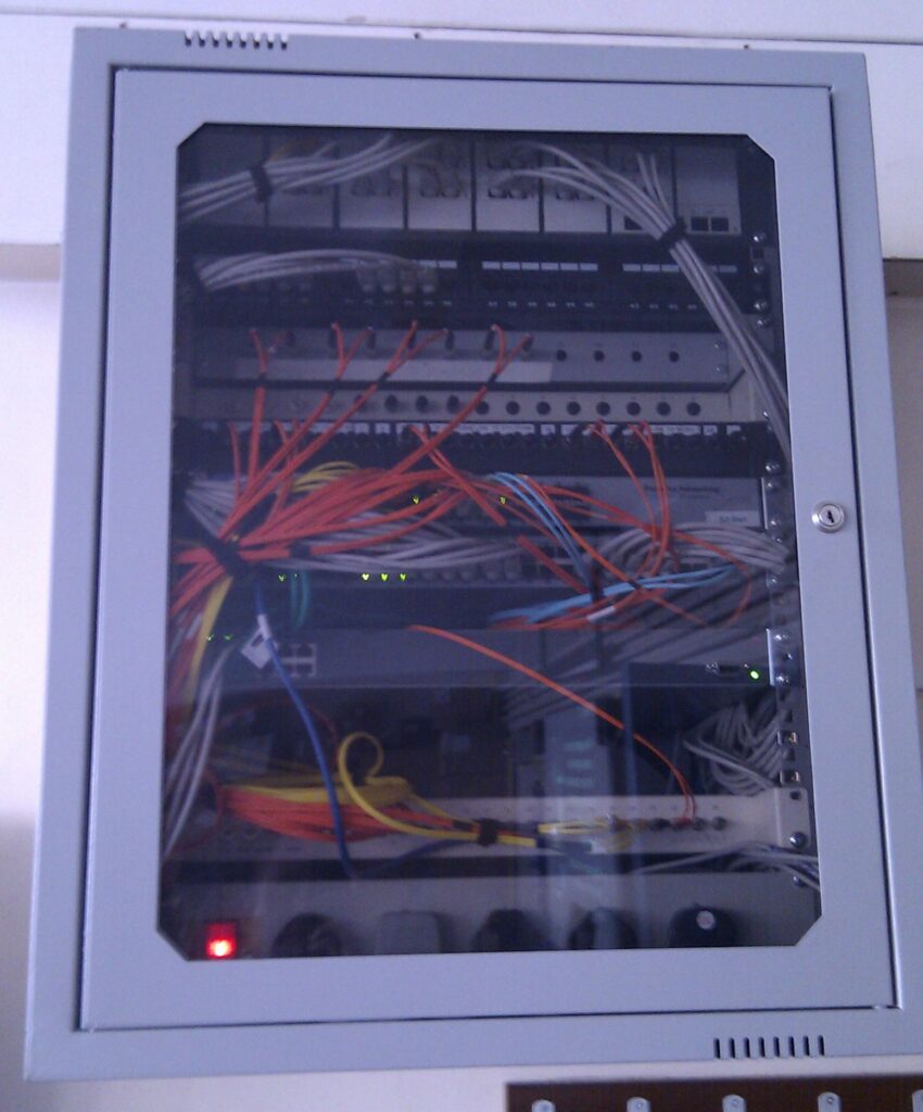 Fiber optic junction box cabinet with patch cables