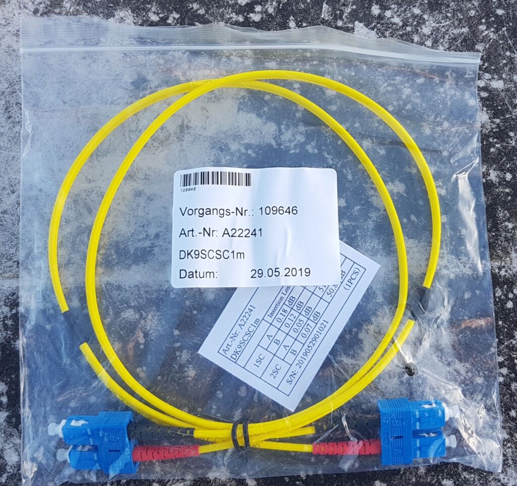 Yellow singlemode SC fiber optic patch cord in packaging